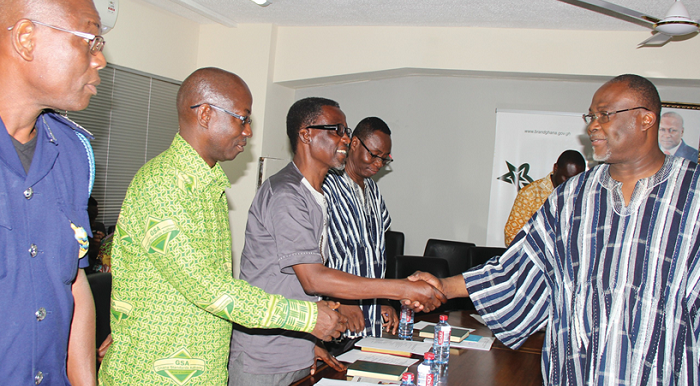 Dr Ekwow Spio-Garbrah (right) congratulating members of the committee after the inauguration Dr Ekwow Spio-Garbrah (right) congratulating members of the committee after the inauguration
