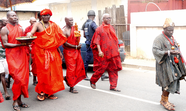 Nii Tetteh Adjabeng II, Chief of Adabraka, sprinkling  kpoikpoi to the gods. INSET: Naa Korkor Adzieoyi I, queenmother of Adabraka speaking at the celebration. Pictures: PATRICK DICKSON  Nii Tetteh Adjabeng II, Chief of Adabraka, sprinkling  kpoikpoi to the gods. INSET: Naa Korkor Adzieoyi I, queenmother of Adabraka speaking at the celebration. Pictures: PATRICK DICKSON
