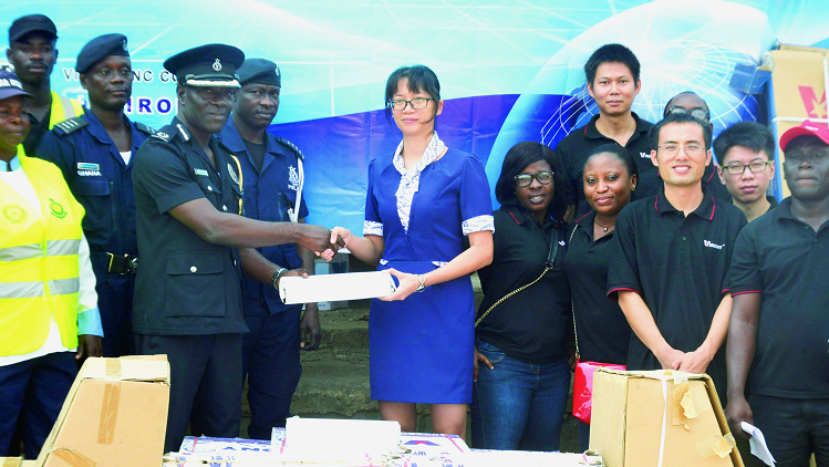 Ms Alyssa Lu, the General Manager of Virony, presenting the items to ACP Ernest Owusu. Picture: Emmanuel Quaye Local company supports police with building materials