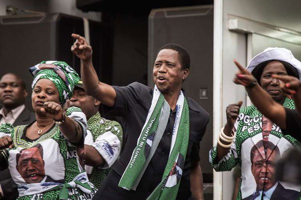 Zambian Ruling party Patriotic Front presidential candidate and incumbent Zambian President Edward Lungu (centre) dancing and gesturing before delivering a speech during his presidential campaign closing rally in Lusaka on August 10, 2016 shows. He was re-elected on August 15, 2016 in a closely-fought vote that the opposition claimed was rigged. AFP PHOTO | GIANLUIGI GUERCIA Zambia’s Lungu re-elected as rival cries foul