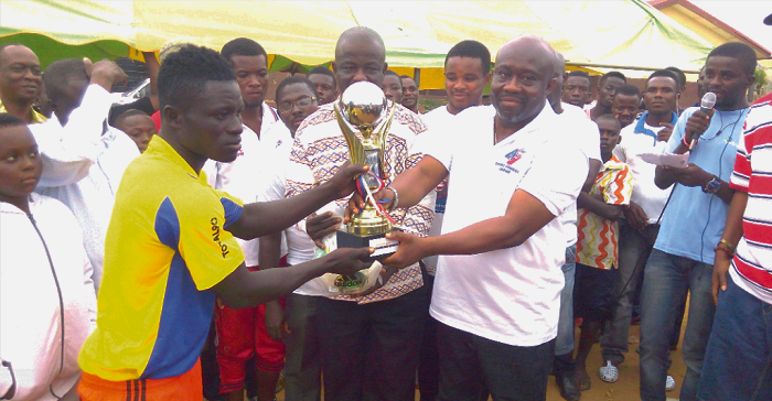 Mr George Andah (right) presenting the trophy to Bonsuoku captain Mr George Andah (right) presenting the trophy to Bonsuoku captain