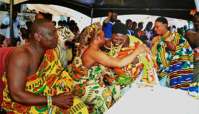 Obrempong Nyanful Krampah XI, Omanhene of the Gomoa Ajumako Traditional Area, embracing Nana Efua Esiwaa II during the ceremony Obrempong Nyanful Krampah XI, Omanhene of the Gomoa Ajumako Traditional Area, embracing Nana Efua Esiwaa II during the ceremony
