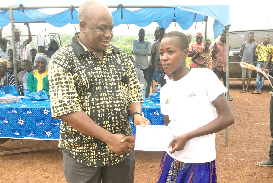 Mr Kumah presenting a certificate to one of the CBE beneficiaries during their graduation Mr Kumah presenting a certificate to one of the CBE beneficiaries during their graduation