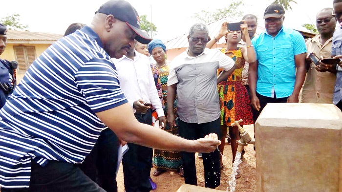 Dr Kwaku Agyeman-Mensah, trying his hand on a standpipe. Picture: Akwasi Ampratwum-Mensah, Dr Kwaku Agyeman-Mensah, trying his hand on a standpipe. Picture: Akwasi Ampratwum-Mensah,