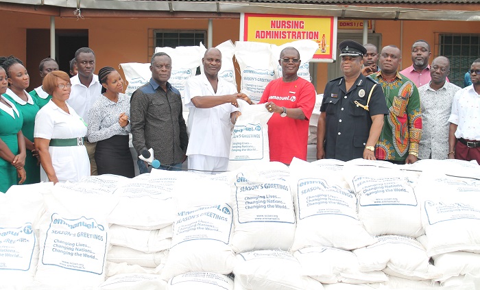 Mr Samuel Sackey (5th right)  presenting the items to Mr Emmanuel Pappoe (6th right). Also in the photograph is Deputy Commissioner David Ampah-Benin (4th right), who is in charge of the Police Intelligence and Professional Standards Bureau (PIPS) Picture: MAXWELL OCLOO