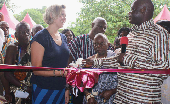 The Deputy Regional Director of Clinical Care, Mr Robert Adatsi (right), cutting the tape with the Country Director of JHPIEGO, Ms Karen Caldwell to inaugurate the model CHPS CHPS Compound in Volta Region upgraded to model sites