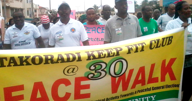 A section of the club members walking through the streets of Takoradi Keep Fit clubs walk for peace in Takoradi