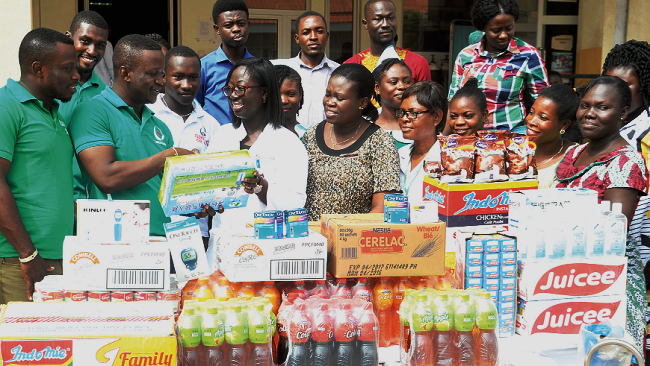 Mr Kenney Teye Kwabena handing over the items to Dr Doreen Atta-Fynn. Those with them are some officials of the company and nurses of the hospital. Picture: EBOW HANSON Flokefama donates to LEKMA Hospital