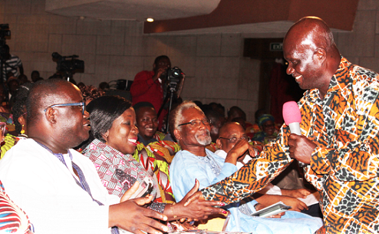 Prof Kofi Agyekum (with mic) exchanging pleasantaries with Mr Ashigbey and Mrs Ofosu-Adjare