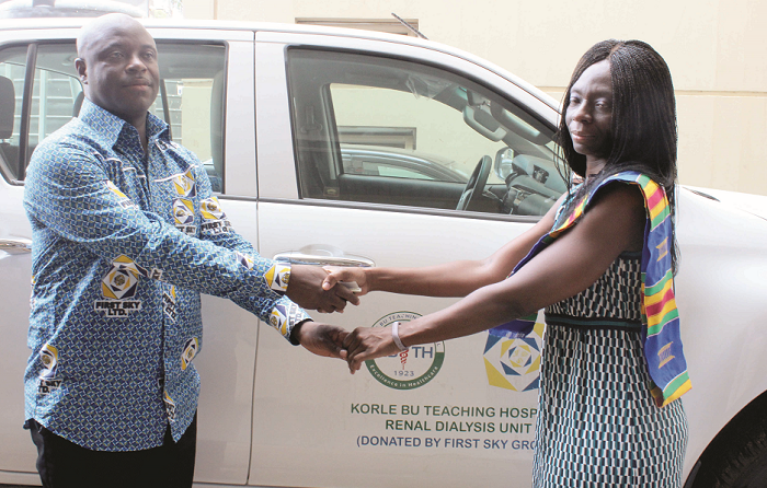  Dr Roberta Lamptey (right), Director, Medical affairs, receiving a donated vehicle on behalf of Renal Dialysis Unit, Korle Bu Teaching Hospital, from Mr Eric Seddy Kutortse (left), Chairman, First Sky Group. Picture: BENEDICT OBUOBI