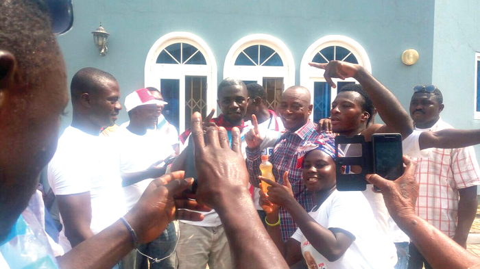 The Member of Parliament-elect for the Madina constituency, Alhaji Boniface Abubakar Saddique (arrowed),  celebrating  with  some of his supporters