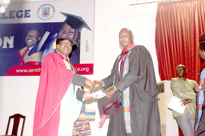 Mr Emmanuel Tetteh (right), a staff of Graphic Communications Group Limited receiving his MBA certificate from Mr Stephen Takyi-Asiedu. Picture: NII MARTEY BOTCHWAY Mr Emmanuel Tetteh (right), a staff of Graphic Communications Group Limited receiving his MBA certificate from Mr Stephen Takyi-Asiedu. Picture: NII MARTEY BOTCHWAY