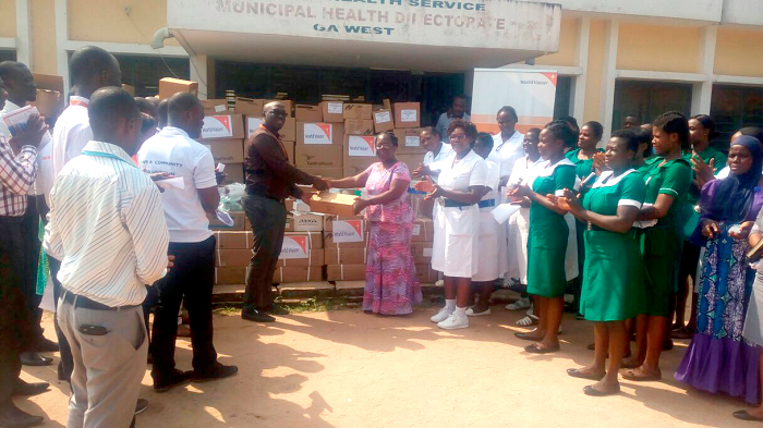  Mr Olad (left) presenting the equipment to Dr Arhin