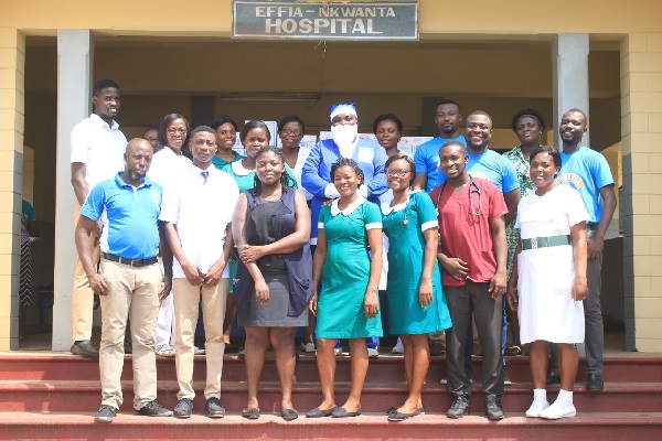 Cowbell and the Effia-Nkwanta staff pose together Cowbell and the Effia-Nkwanta staff pose together