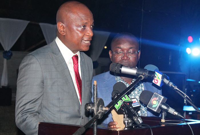  Torgbui Afede XIV (left) addressing some customers of the bank. With him is Mr John Asamoah, CEO, NIB. PICTURE: MAXWELL OCLOO
