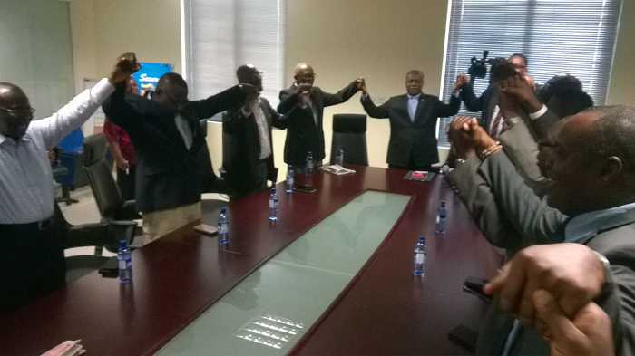  Rt Rev. Prof. Omenyo (at the head of table) join hands in prayer with other ministers and executive of FGBMFI after the meeting