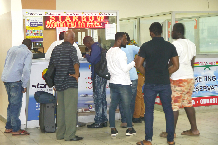  Some frustrated passengers in front of Starbow airlines office at KIA.  PICTURE: PATRICK DICKSON   