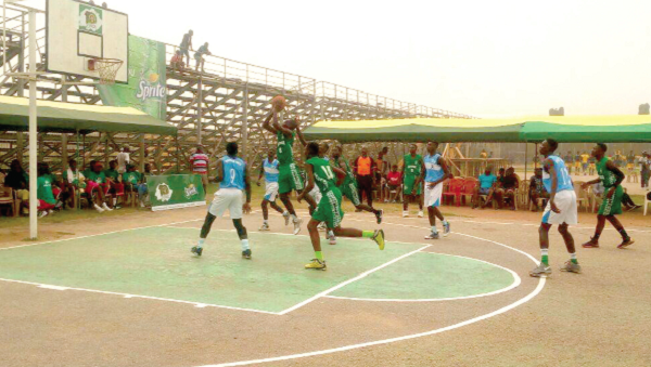 Players of St Augustine’s (in green) attacking their opponents during the match Spriteball Basketball Champs: St Augustine’s ride on