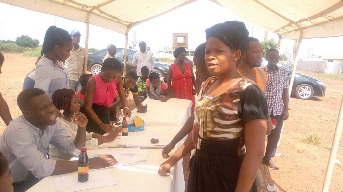  Some of residents going through the NHIS registration process at Ayawaso West Wuogon after a health walk