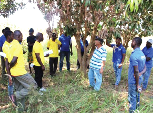 Mr Aoun Bassam George (arrowed) interacting with some of the farmers