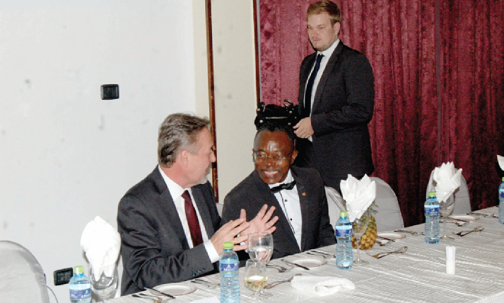  Mr Stephen Antwi (right) sharing a point with Mr Chrishoph Retzlaff, the German Ambassador.