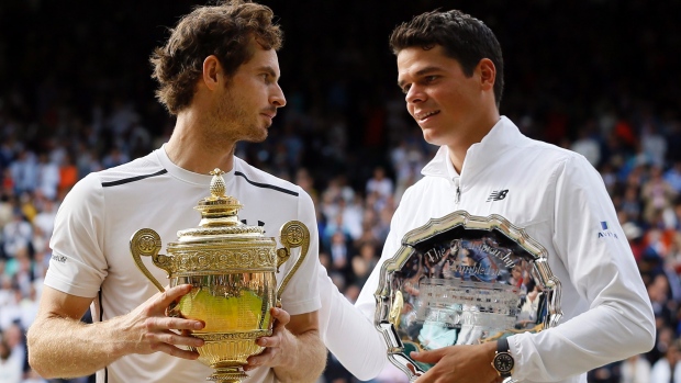 Andy Murray of Britain holds up his trophy after beating Milos Raonic of Canada (right) Andy Murray of Britain holds up his trophy after beating Milos Raonic of Canada (right)