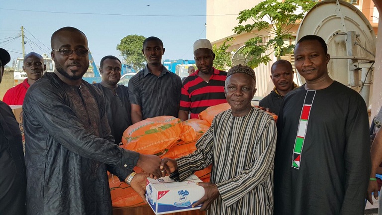 Picture shows Mr Nasiru (left) presenting the items to Mr Sako Don’t take Zongos for granted - NDC Chairman tells NDC