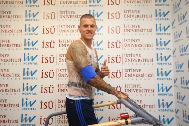 Martin Skrtel gives a thumbs up as he prepares to sign for Fenerbahce Martin Skrtel gives a thumbs up as he prepares to sign for Fenerbahce