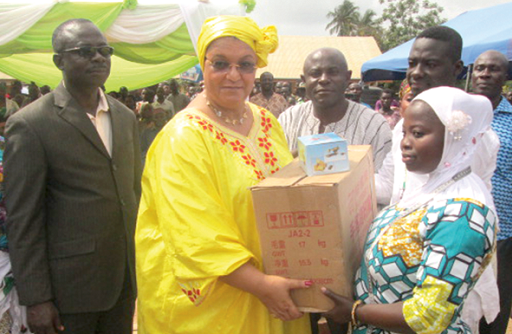 Madam Hanna Serwaa Tetteh, MP for Awutu Senya West (left), presenting a sewing machine to Rukayatu Adam, one of the trainees, during the ceremony 