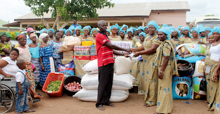 Mrs Ella Attih presenting the items to Mr Nelson Atiko (left), with Mrs Enyonam Ganyo-Tefe (right) looking on Mrs Ella Attih presenting the items to Mr Nelson Atiko (left), with Mrs Enyonam Ganyo-Tefe (right) looking on