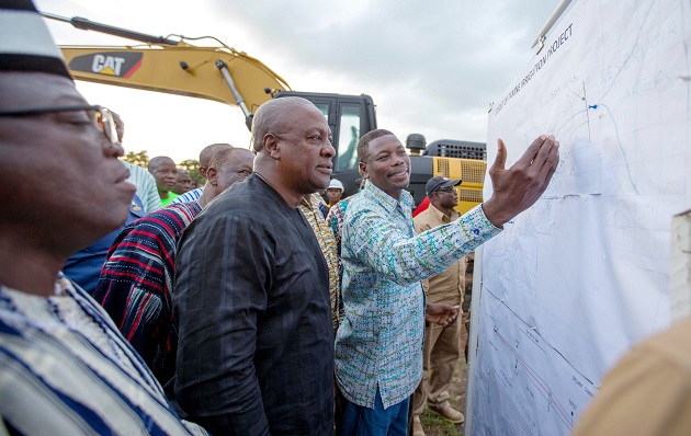 President Mahama having a look at the diagrams for the Tamne Irrigation Dam project. INSET: President Mahama breaking the ground for construction work on the Temne Irrigation Dam to begin. President Mahama having a look at the diagrams for the Tamne Irrigation Dam project. INSET: President Mahama breaking the ground for construction work on the Temne Irrigation Dam to begin.