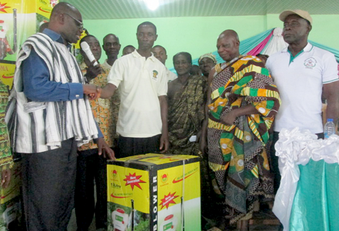 Mr Charles Obeng-Inkoom, MP for Agona West, (left) in a handshake with Mr Kojo Korankye, the Chairman of the Cocoa Farmers Association, after presenting the machines to him Mr Charles Obeng-Inkoom, MP for Agona West, (left) in a handshake with Mr Kojo Korankye, the Chairman of the Cocoa Farmers Association, after presenting the machines to him