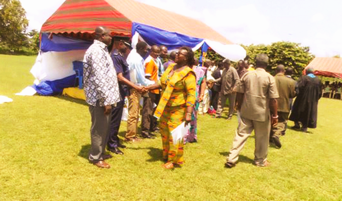 Ms Gertrude Mensah congratulating the board members  of Salvation Army Senior High School at Akyem Wenchi during the ceremony