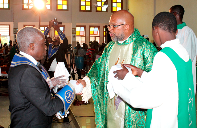 Rev. Father Andrew Anumu Quaye-Foli (right), Parish Priest, St Charles Lwanga Catholic Church, in a handshake with Worthy Brother Evaristus Kwatsinu (left), Regional Grand Knight of the Accra West Regional Council Picture: MAXWELL OCLOO Rev. Father Andrew Anumu Quaye-Foli (right), Parish Priest, St Charles Lwanga Catholic Church, in a handshake with Worthy Brother Evaristus Kwatsinu (left), Regional Grand Knight of the Accra West Regional Council Picture: MAXWELL OCLOO