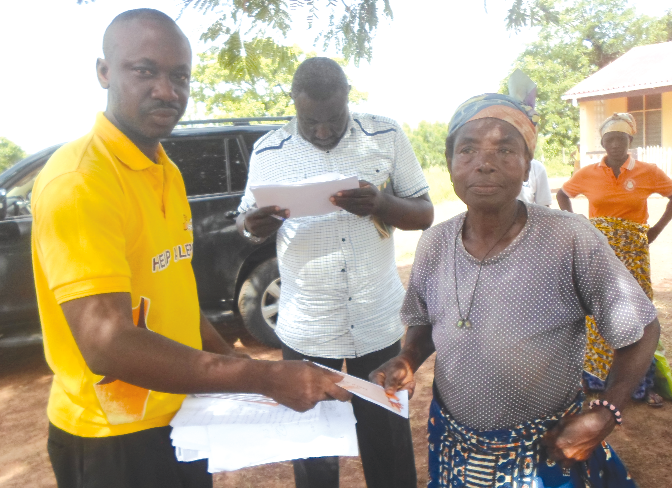 One of the curred lepers receiving her share of the District Assemblies Common Fund from Mr Martin Tandoh (left) One of the curred lepers receiving her share of the District Assemblies Common Fund from Mr Martin Tandoh (left)