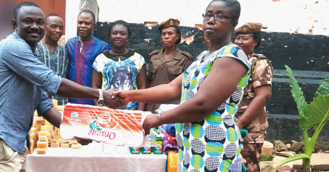 Mr Ebenezer Whyte Opoku (left) presenting the items to ASP Gladys Adu Two organisations donate to Kumasi Central Prisons