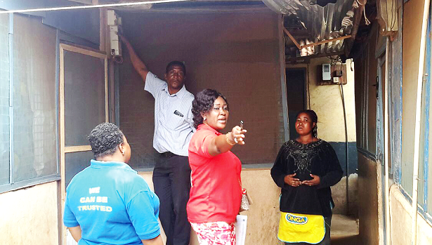 Ms Rosemond Asamoah Frimpong explaining to a customer (right) why her premises were being disconnected while an official of the Loss Control Unit disconnects the meter Ms Rosemond Asamoah Frimpong explaining to a customer (right) why her premises were being disconnected while an official of the Loss Control Unit disconnects the meter