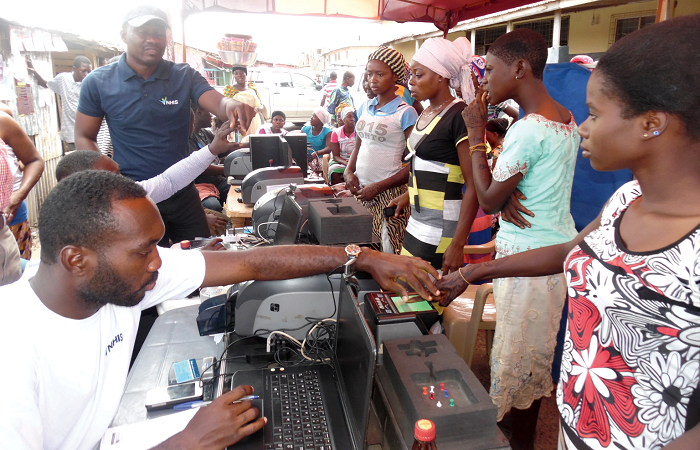 Some of the female porters going through the process of  registering for the National Health Insurance Scheme (NHIS)