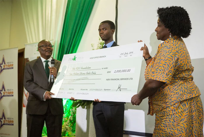 Mr. Oko-Nikoi Dzani, Managing Director of NDK presenting a cheque for the seed money of the fund to the Chairman of the Foundation Prof. Ellen Bortie-Doku Aryeetey NDK Financial Services launches CSR Foundation