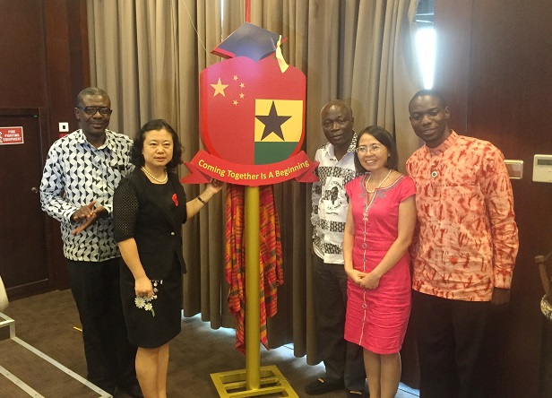The Chinese Ambassador, Madam Sun Baohong ,Minister for Youth and Sports, Edwin Nii Lante Vanderpuye, Dr Meilan Mei and deputy Greater Accra regional minister  Isaac Nii Djanmah Vanderpuye and President of CGAA Mr. Charles Mawuenyega pose with the new unveiled logo of the association.