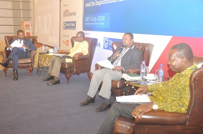 Dr Vladimin Antwi-Danso (2nd right), Dean of Academic Affairs, Ghana Armed Forces and Staff College, speaking at the meeting. Those with him are Mr Anthony Nyame-Baafi (right), Director, Multilateral, Regional and Bilateral Trade, MOTI, Nana Osei Bonsu (extreme left), CEO, Private Enterprise Federation, and  Dr Yao Graham, Executive Director, Third World Network.  Pictures: DOUGLAS ANANE-FRIMPONG & SAMUEL TEI ADANO