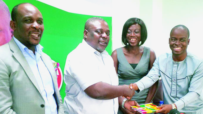 Dr Ishmael Ackah, Head of Policy, ACEP (right) presenting the new study to Mr Koku Anyidoho (2nd left) the Deputy General-Secretary of the NDC Five parties to adopt ACEP’s study into manifestos