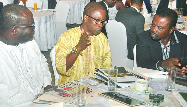 Dr Yao Graham (middle), a panelist interacting with Dr Vladimin Antwi-Danso (right) and Mr Kenneth Ashigbey (left), Managing Director, GCGL Graphic Business, Stanbic hold breakfast meeting on EPA