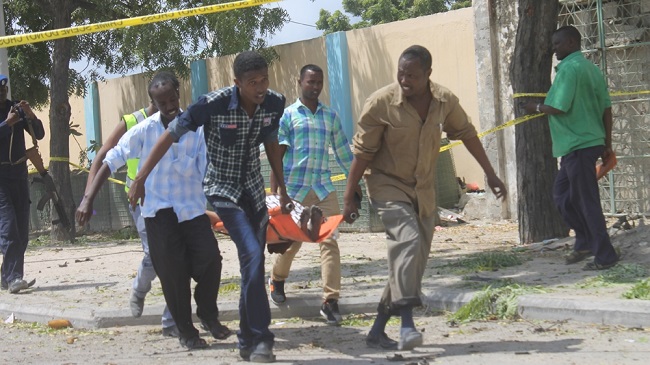 At least 10 killed as suicide bomber rams car into Criminal Investigation Department building in Somali capital. At least 10 killed as suicide bomber rams car into Criminal Investigation Department building in Somali capital.