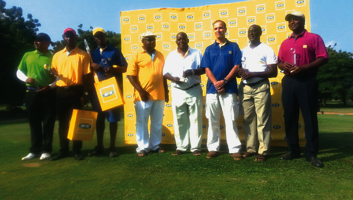 Some of the winners displaying their trophies Amenyo, Mona grab MTN classic golf