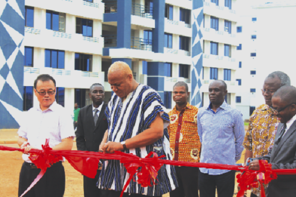 Prof. Joshua Alabi being assisted to cut the sod for the project UPSA cuts sod for GH¢77m auditorium project