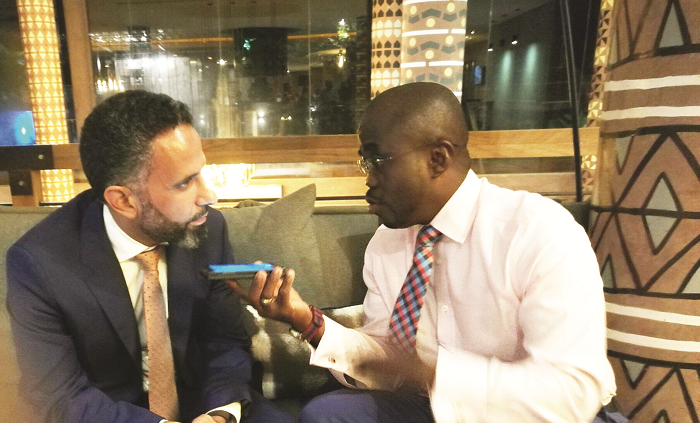 Mr Fakhry (left) explaining a few issues to Mr Charles Benoni Okine, Assistant Editor of Graphic Business
