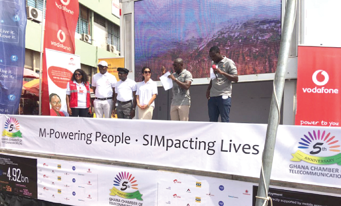  Mr Kwaku Sakyi-Addo (2nd right) being supported by some CEOs of MNOs to address the public.