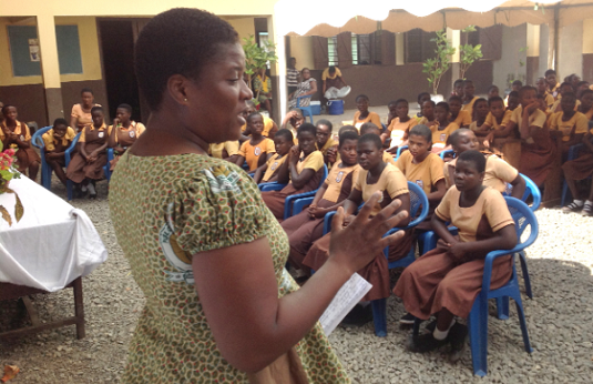 Ms Augustina Pambim, Public Health Nurse educating pupils on maintaining  good personal hygiene during menstruation