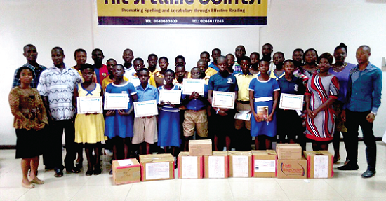 Pupils of some selected schools displaying boxes of books presented to them